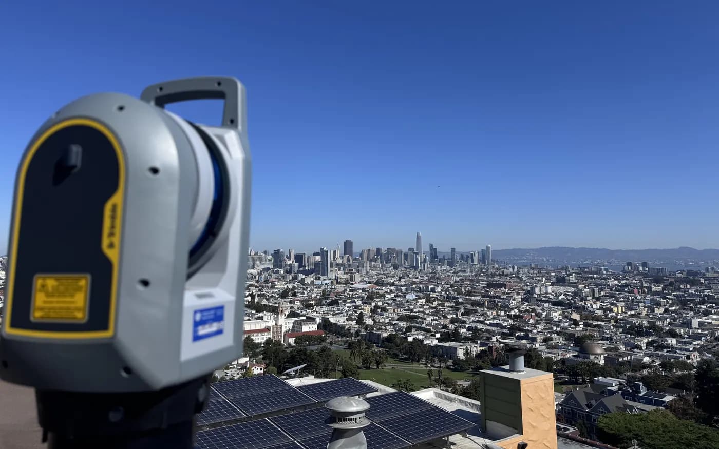 Contour Survey's Trimble X9 laser scanner on a San Francisco rooftop, with the downtown skyline behind it