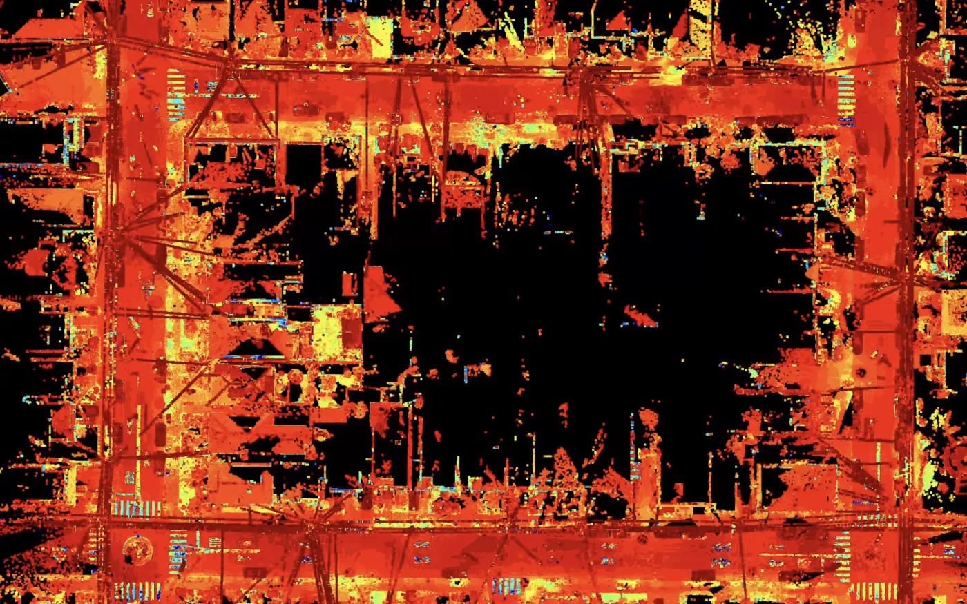 Same city block scan colored by intensity, showing curbs, crosswalks, and pavement markings