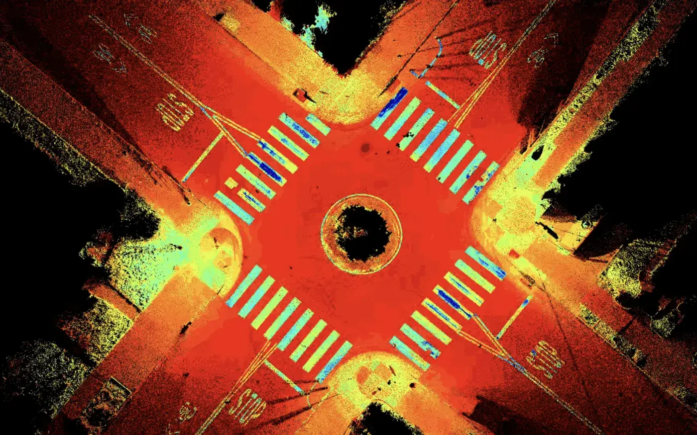 Plan view of a scanned street intersection colored by intensity, showing crosswalks and pavement markings